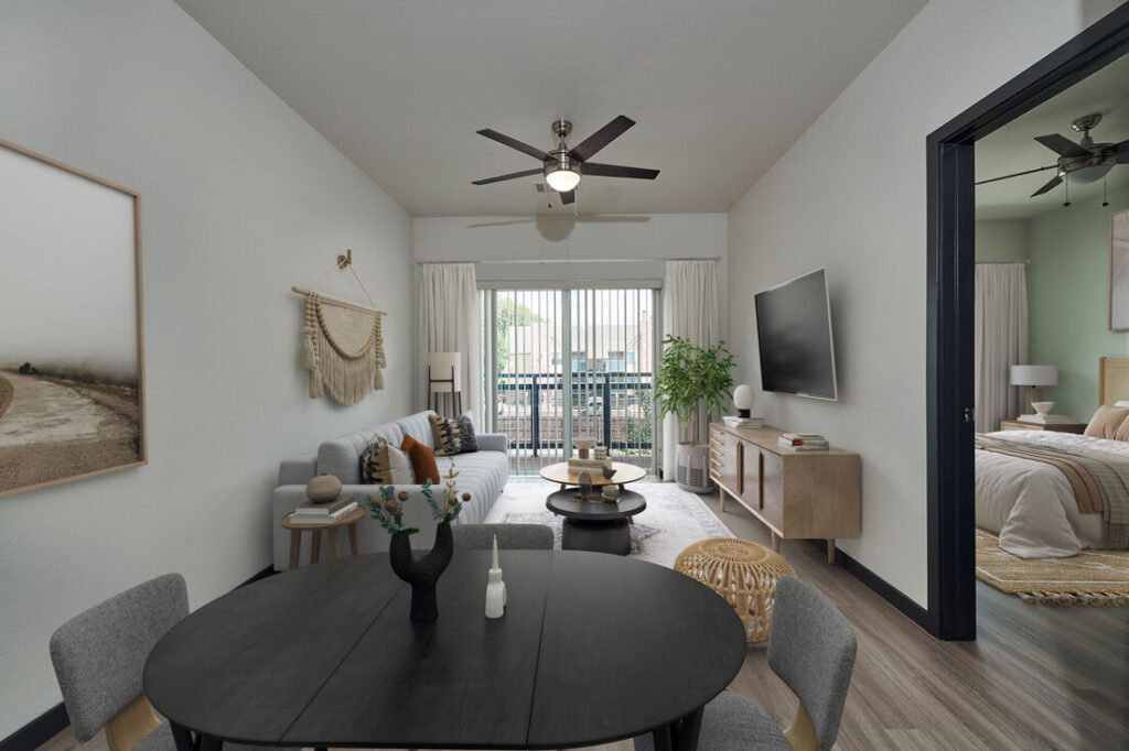 Open-concept living room with patio at Westbury Apartments in Westminster, CO