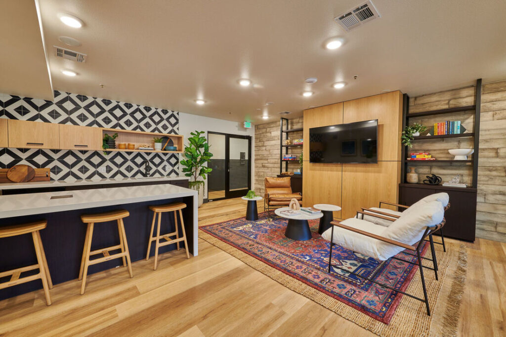 Clubhouse lounge with comfortable seating at Westbury Apartments in Westminster, CO