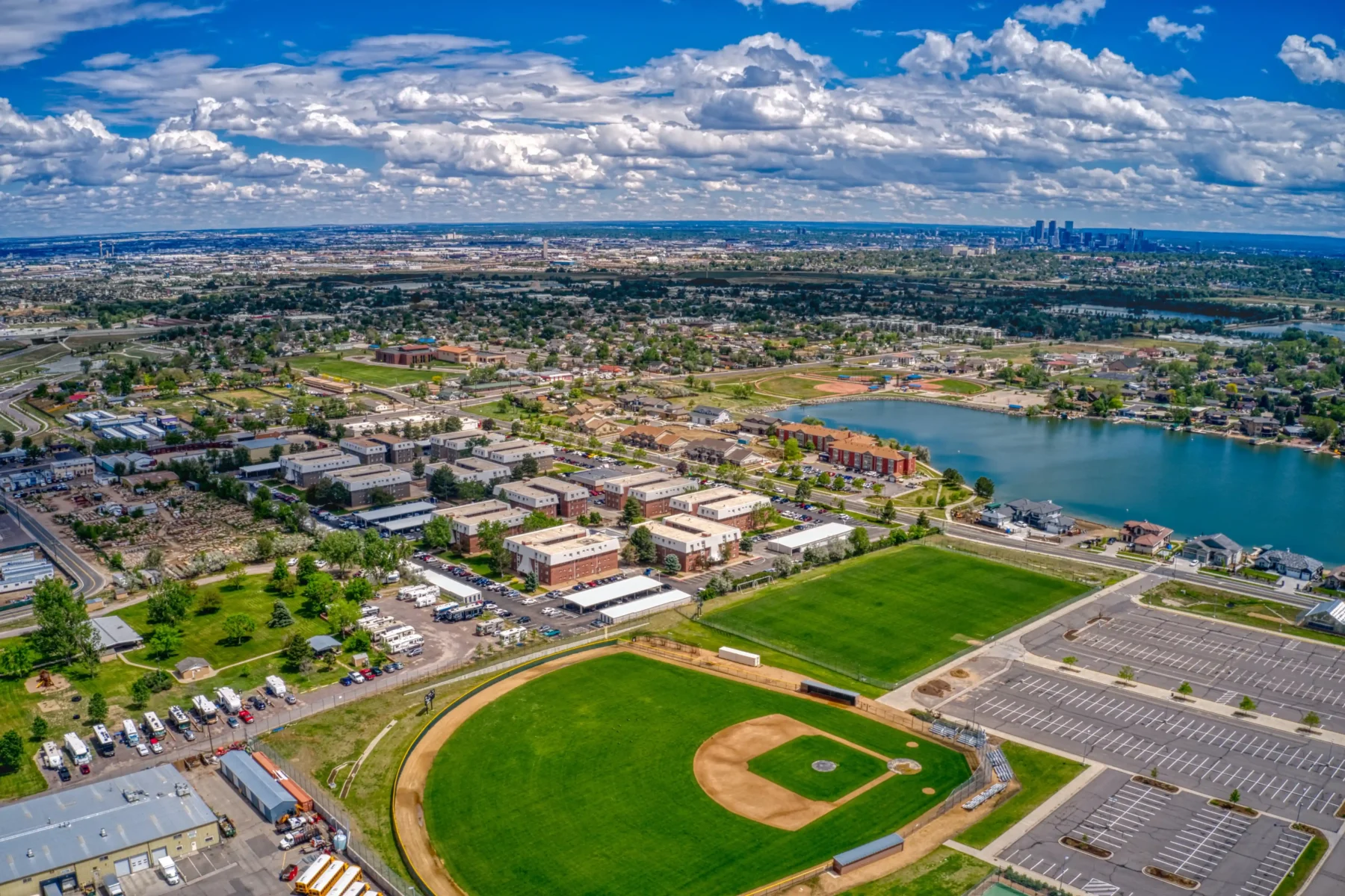 Aerial view of Westminster Colorado with Denver skyline in the distance